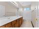 Bathroom with a double sink vanity, tile floor, a large mirror, and a shower and tub combo at 2925 E Cathy E Dr, Gilbert, AZ 85296