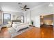 Staged primary bedroom featuring a plush bed, hardwood floors, and ample natural light at 2925 E Cathy E Dr, Gilbert, AZ 85296