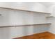 Spacious walk-in closet boasts ample shelving and wood floors at 2925 E Cathy E Dr, Gilbert, AZ 85296