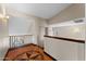 Second-story hallway with hardwood floors, decorative inlay, and natural light at 2925 E Cathy E Dr, Gilbert, AZ 85296