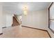 Inviting open living area with staircase, tile flooring, chandelier, and great natural light at 2925 E Cathy E Dr, Gilbert, AZ 85296