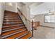 Classic staircase design with wood steps and railing leading to the upper level at 2925 E Cathy E Dr, Gilbert, AZ 85296