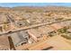 Expansive aerial view of a community showcasing single-Gathering homes and neighborhood streets with mountain views at 3287 N 197Th Ln, Buckeye, AZ 85396