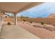 Relaxing covered patio overlooks the desert-landscaped backyard, offering a private outdoor retreat at 3287 N 197Th Ln, Buckeye, AZ 85396