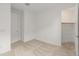 Light and bright bedroom featuring neutral carpet and a walk in closet at 3287 N 197Th Ln, Buckeye, AZ 85396