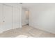 Bedroom featuring neutral carpet and sliding closet doors at 3287 N 197Th Ln, Buckeye, AZ 85396