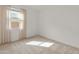 Bright bedroom featuring neutral carpet and a window allowing ample natural light at 3287 N 197Th Ln, Buckeye, AZ 85396