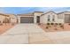 Charming single-story home featuring a neutral color scheme, two-car garage and low maintenance landscaping at 3287 N 197Th Ln, Buckeye, AZ 85396