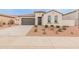 Charming single-story home featuring a neutral color scheme, two-car garage and low maintenance landscaping at 3287 N 197Th Ln, Buckeye, AZ 85396