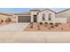 Charming single-story home featuring a neutral color scheme, two-car garage and low maintenance landscaping at 3287 N 197Th Ln, Buckeye, AZ 85396