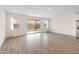 Bright living room featuring tile floors and sliding glass doors to the backyard at 3287 N 197Th Ln, Buckeye, AZ 85396