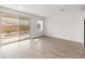 Bright living room featuring tile floors and sliding glass doors to the backyard at 3287 N 197Th Ln, Buckeye, AZ 85396