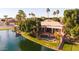 A captivating aerial shot showcasing the property's lakefront access, pool, and meticulously landscaped yard at 3441 S Camellia Pl, Chandler, AZ 85248