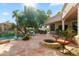 Stunning backyard features pool, spa, outdoor kitchen, fire pit, and lake views at 3441 S Camellia Pl, Chandler, AZ 85248