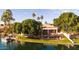 An aerial view of a backyard that provides a lake, pool and lush landscaping at 3441 S Camellia Pl, Chandler, AZ 85248