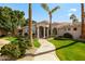 Stunning home exterior showcasing a manicured lawn, stone walkway, and elegant architectural details at 3441 S Camellia Pl, Chandler, AZ 85248