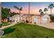 Stunning desert home featuring manicured landscaping, a circular entrance, and a three-car garage at 3441 S Camellia Pl, Chandler, AZ 85248