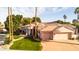 Beautiful home features mature landscaping, a three-car garage, and inviting architectural details at 3441 S Camellia Pl, Chandler, AZ 85248