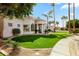 The home's exterior has a well-maintained lawn, desert landscaping, and an inviting entryway at 3441 S Camellia Pl, Chandler, AZ 85248