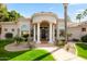 Beautiful exterior view of the home featuring a grand entrance, manicured lawn, and lush landscaping at 3441 S Camellia Pl, Chandler, AZ 85248