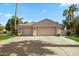 Three-car garage with mature trees at 3441 S Camellia Pl, Chandler, AZ 85248