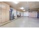 Spacious garage with epoxy flooring, built-in cabinets, and ample storage space at 3441 S Camellia Pl, Chandler, AZ 85248