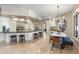 Wide angle view of the large kitchen island that flows into the nearby dining room at 3441 S Camellia Pl, Chandler, AZ 85248