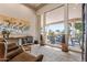 Bright living room featuring floor-to-ceiling windows with views of the outdoor patio and pool area at 3441 S Camellia Pl, Chandler, AZ 85248