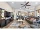 Large living room featuring leather sofa and entertainment system at 3441 S Camellia Pl, Chandler, AZ 85248