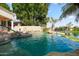 Stunning pool with rock features and scenic views offers a tranquil retreat at 3441 S Camellia Pl, Chandler, AZ 85248