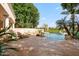 Resort-style pool area with lush landscaping and a cozy fire pit, great for relaxing at 3441 S Camellia Pl, Chandler, AZ 85248