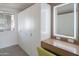 Closet with white built-ins, vanity with illuminated mirror, and natural light for getting ready at 3531 E Onyx Ave, Phoenix, AZ 85028