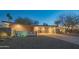 Mid-century modern home featuring stylish brickwork, desert landscaping, and a welcoming covered entryway at 3531 E Onyx Ave, Phoenix, AZ 85028