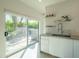 Bright, modern kitchen with stainless steel appliances and marble countertops, flowing to outdoor living at 3531 E Onyx Ave, Phoenix, AZ 85028