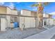 Townhome exterior with white gravel landscaping and palm tree at 3646 N 69Th Ave # 38, Phoenix, AZ 85033