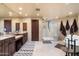 Bathroom features a walk-in shower, vanity area, soaking tub and natural lighting at 40947 N 107Th Pl, Scottsdale, AZ 85262