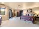 Spacious bedroom with walk-out to a private balcony and en-suite bathroom at 40947 N 107Th Pl, Scottsdale, AZ 85262