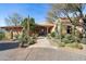 Attractive desert home with stone pathway leading to front door with beautiful xeriscaping at 40947 N 107Th Pl, Scottsdale, AZ 85262