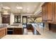 Gourmet kitchen with granite countertops, stainless appliances, and panoramic views at 40947 N 107Th Pl, Scottsdale, AZ 85262