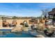 Outdoor living by the pool includes a bbq, lounge chairs, desert landscape and a water feature at 40947 N 107Th Pl, Scottsdale, AZ 85262