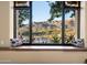 Scenic outdoor view from the window with desert landscape and mountains in the background at 40947 N 107Th Pl, Scottsdale, AZ 85262