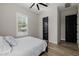 Bright bedroom featuring a ceiling fan, wood-look flooring and lots of natural light at 4191 S Emerald Dr, Chandler, AZ 85249