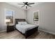 Cozy bedroom with wood-look floors, a comfortable bed, and plantation shutters at 4191 S Emerald Dr, Chandler, AZ 85249