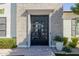 Modern brick facade with statement front door, brick path, and professional landscaping at 4191 S Emerald Dr, Chandler, AZ 85249