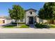 Lovely home featuring manicured landscaping, mature trees, and a charming brick and stucco facade at 4191 S Emerald Dr, Chandler, AZ 85249