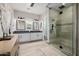 A luxurious main bathroom featuring a glass-enclosed shower, dual sinks, and modern fixtures for a spa-like experience at 4191 S Emerald Dr, Chandler, AZ 85249