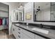 A modern bathroom with dual sinks, sleek countertops, and ample storage offers a stylish and functional space at 4191 S Emerald Dr, Chandler, AZ 85249