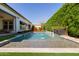 Inviting pool surrounded by mature trees and artificial turf, and accented by a fountain water feature at 4191 S Emerald Dr, Chandler, AZ 85249