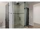 Glass enclosed shower stall with decorative tile and a rainfall shower head at 4191 S Emerald Dr, Chandler, AZ 85249