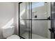 Contemporary shower room with sleek glass doors and modern white textured tiling at 4191 S Emerald Dr, Chandler, AZ 85249